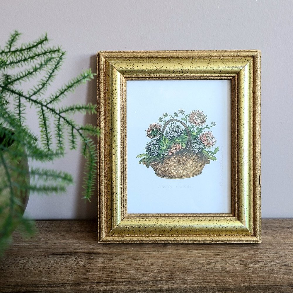 Small framed picture. Flowers in basket. Signed by artist.